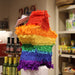 Star shaped piñata covered in rainbow colours